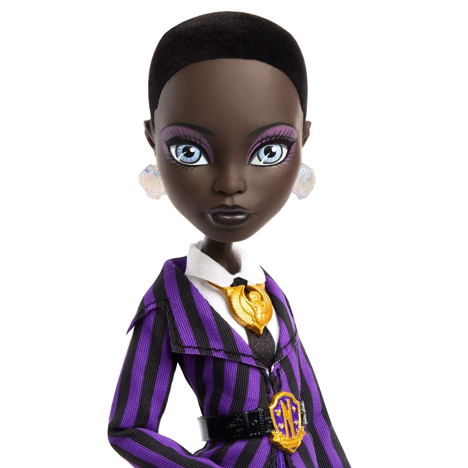 Doll in a purple and black outfit with a white background