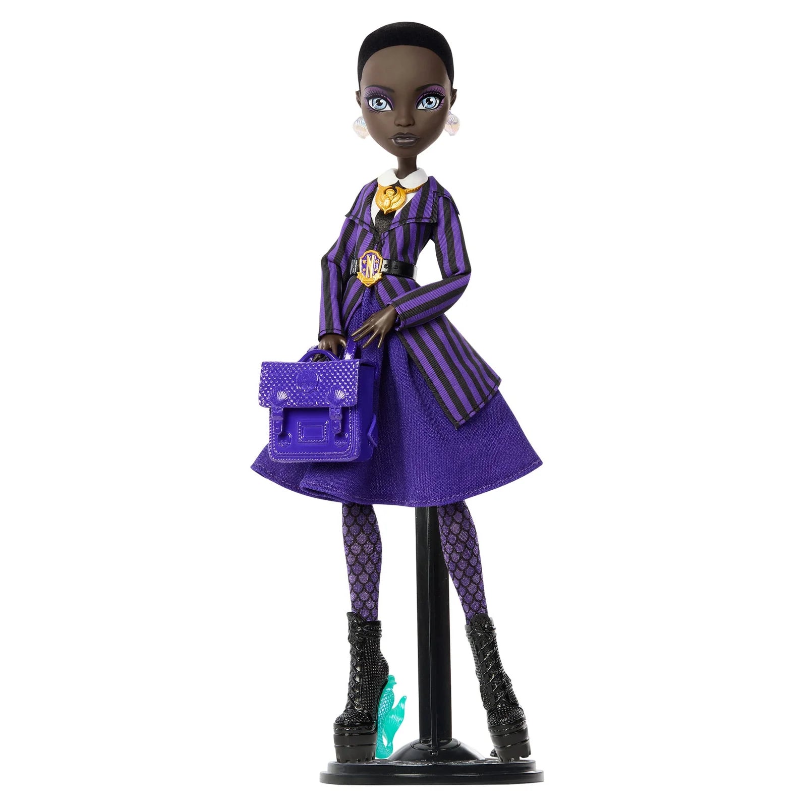 Doll in a purple outfit with a matching handbag on a white background