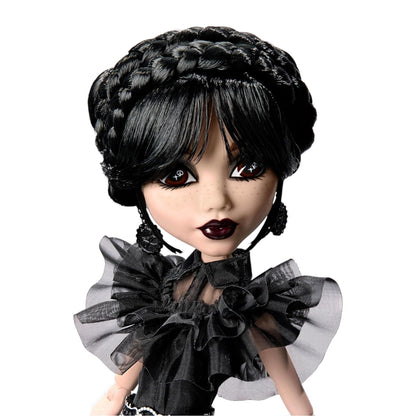 Wednesday Addams Monster High Doll with braided black hair and dark makeup wearing a black outfit on a white background