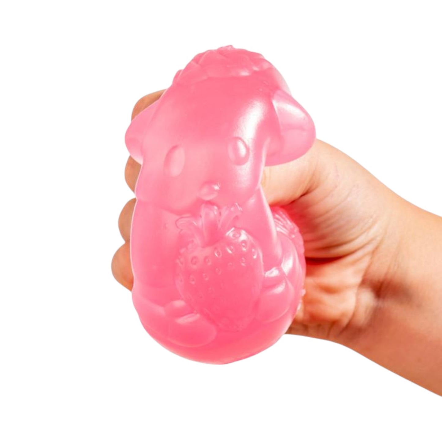 Pink silicone dog toy held in a hand against a white background