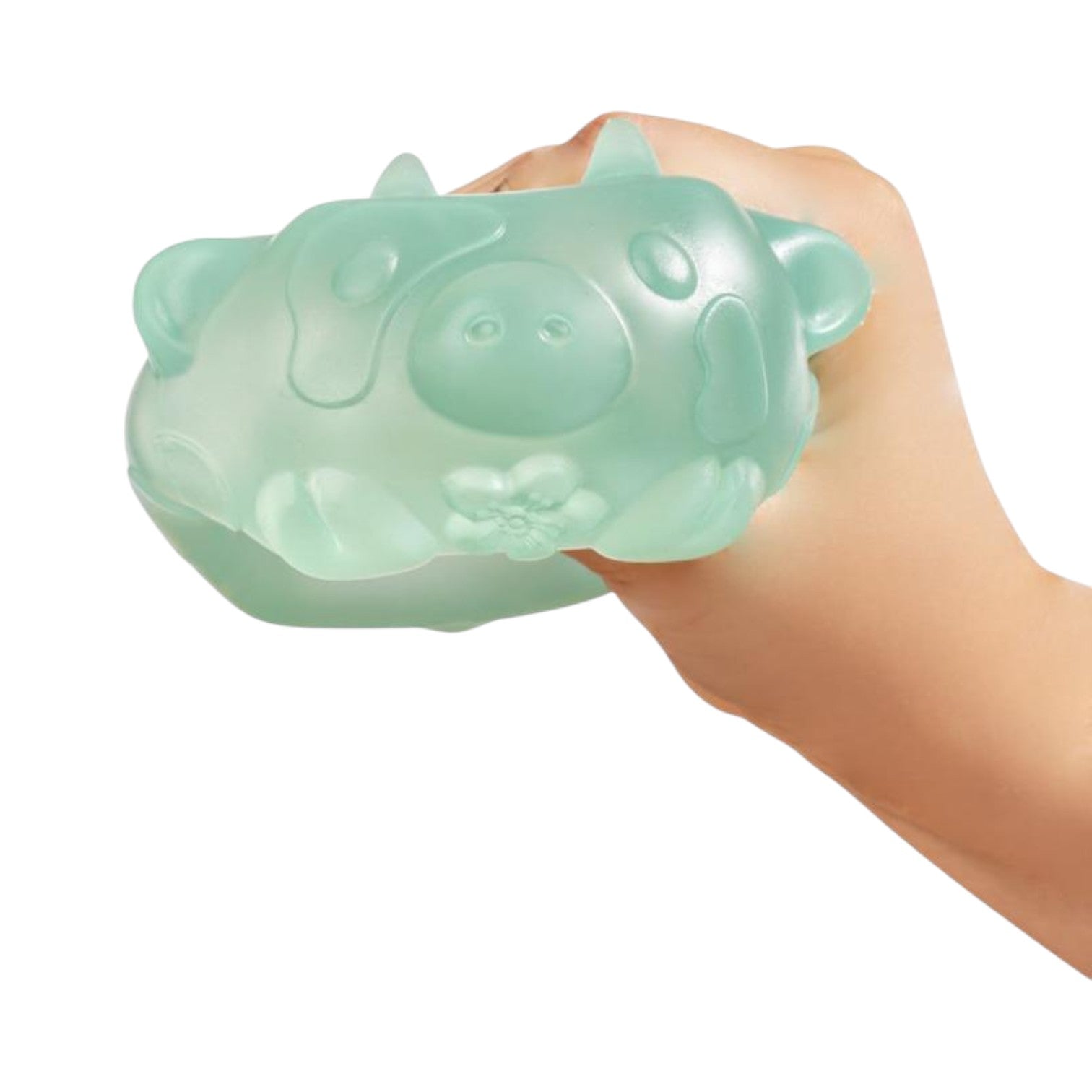Hand holding a green jade Mushikins Squishy Toy against a white background