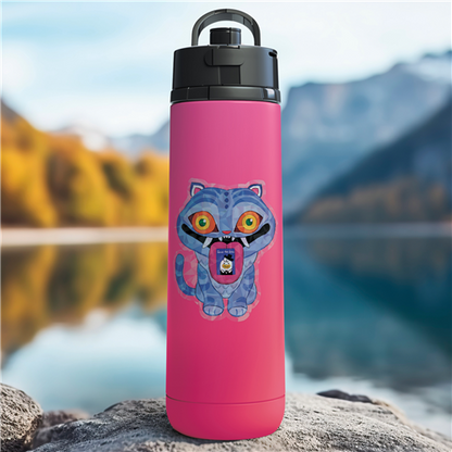 Pink water bottle with a cartoon character on a rock by a lake with mountains in the background