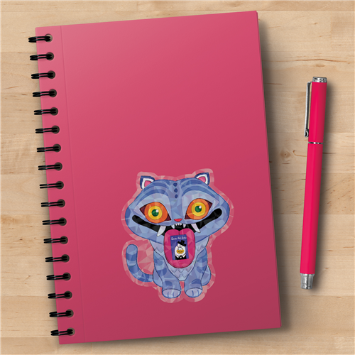 Pink notebook with a cartoon cat design on a wooden surface with a pink pen.