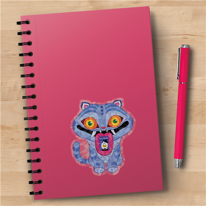 Pink notebook with a cartoon cat design on a wooden surface with a pink pen.