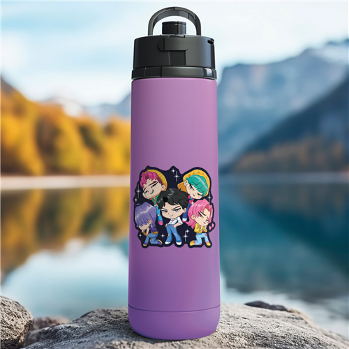 Purple water bottle with cartoon characters on a rock by a lake with mountains in the background