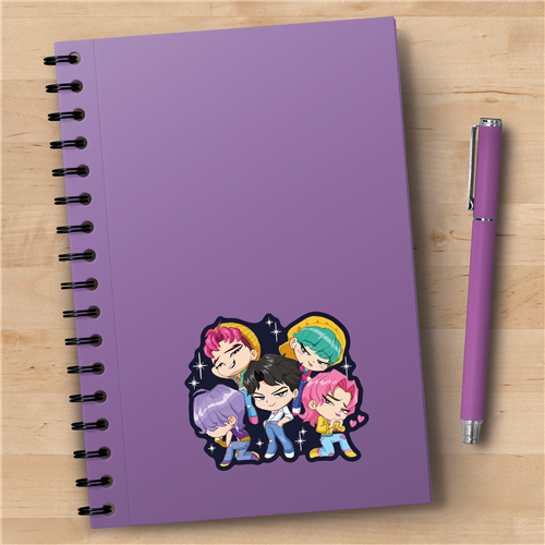 Purple notebook with cartoon characters and a matching pen on a wooden surface