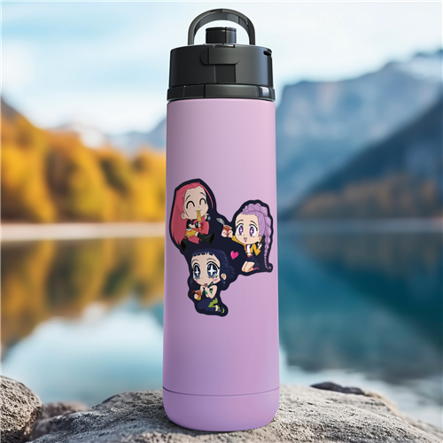 Purple water bottle with cartoon characters on a rock by a lake with mountains in the background