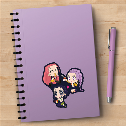 Purple notebook with cartoon characters on a wooden surface next to a pink pen.