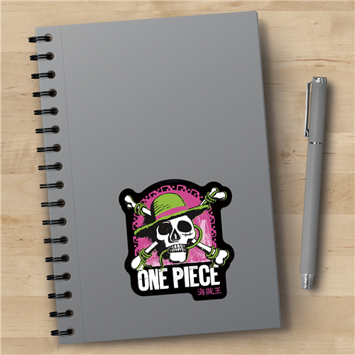 Gray notebook with 'One Piece' design and a pen on a wooden surface