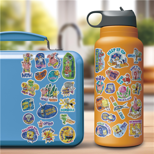 Blue lunch box and orange water bottle with colorful stickers on a blurred outdoor background