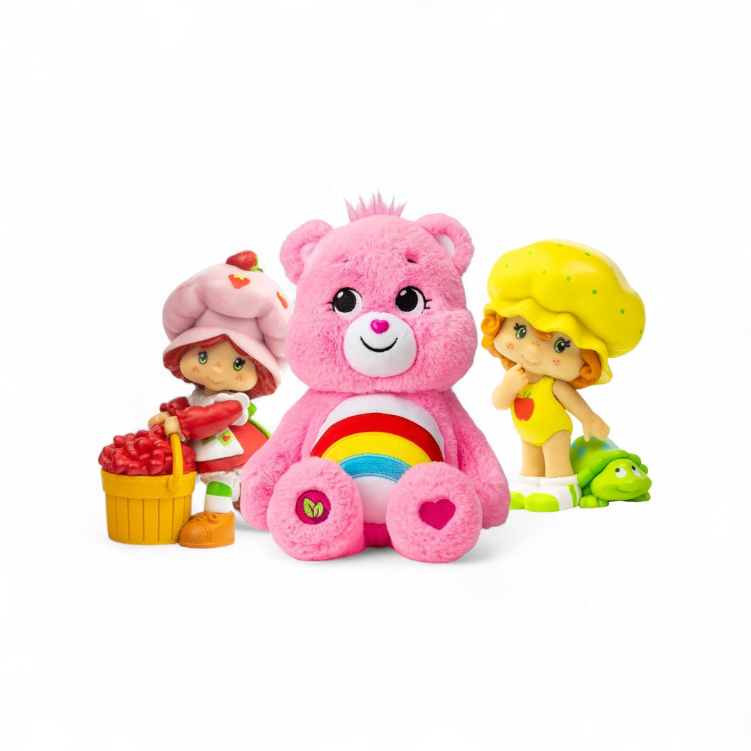 One Strawberry Shortcake minifigure, one plush Care Bear and one Apple Dumplin mini figure.