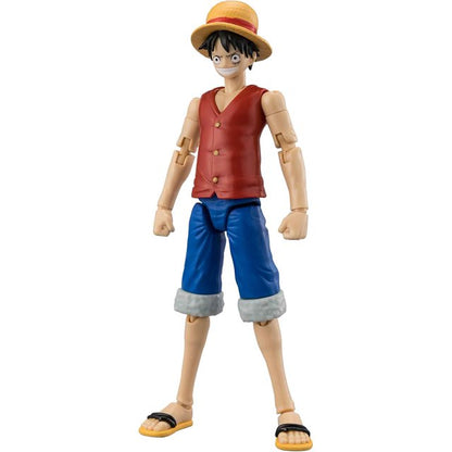 A plastic action figure of the anime character Luffy from One Piece, standing on a plain white background. He is wearing his signature straw hat, red vest, blue shorts, and black sandals.
