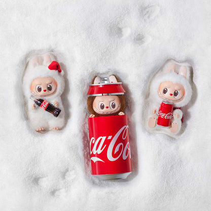 Three Lababu the Monsters Plush Pendants with Coca-Cola theme on a snowy background