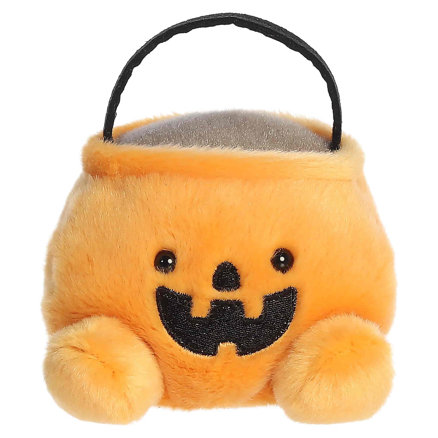 Palm Pals Bucky Candy Bucket 4-inch orange plush pumpkin treat bag with a black handle and embroidered jack-o'-lantern mouth.