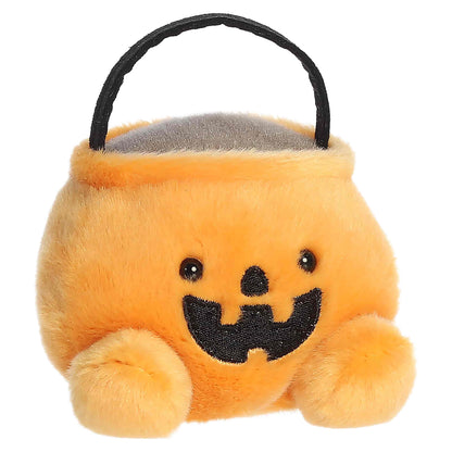 Palm Pals Bucky Candy Bucket 4-inch orange plush pumpkin treat bag with a black handle and embroidered jack-o'-lantern mouth.