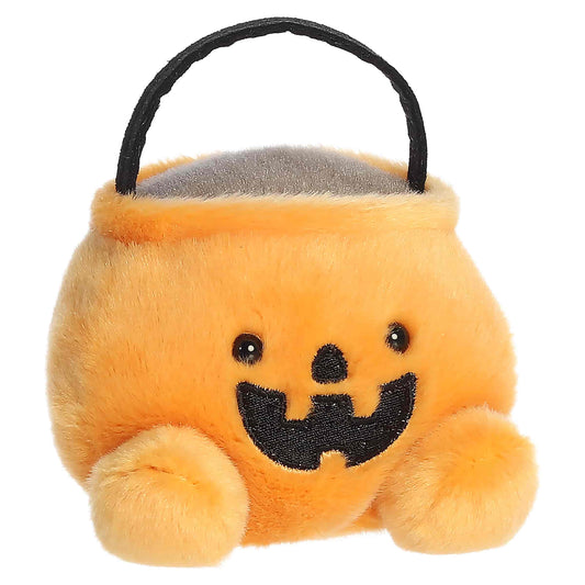 Palm Pals Bucky Candy Bucket 4-inch orange plush pumpkin treat bag with a black handle and embroidered jack-o'-lantern mouth.