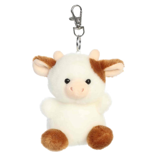 Palm Pals Caroline Brown Cow Clip-On plush featuring soft brown and white fur, cute little horns, and a metal keychain clip.