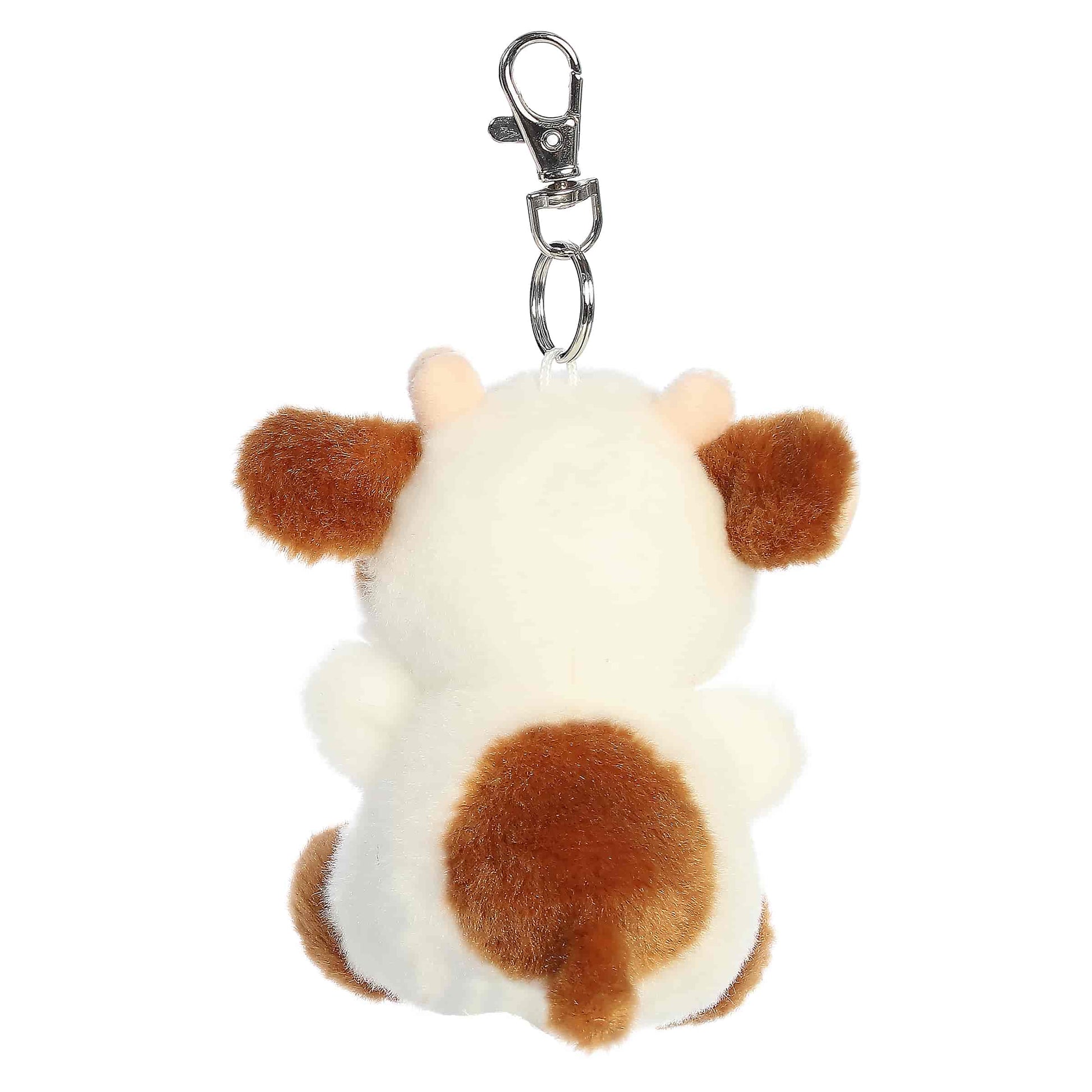 Palm Pals Caroline Brown Cow Clip-On plush featuring soft brown and white fur, cute little horns, and a metal keychain clip.