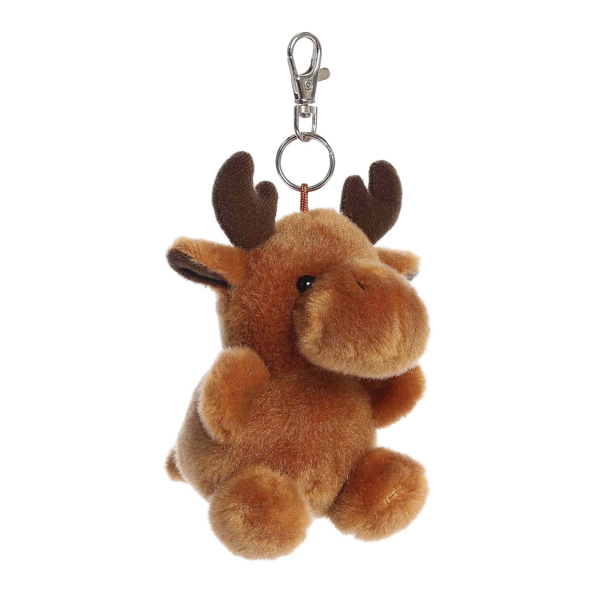 Angled view of Palm Pals Cinnamon Moose, a 4-inch brown plush clip.