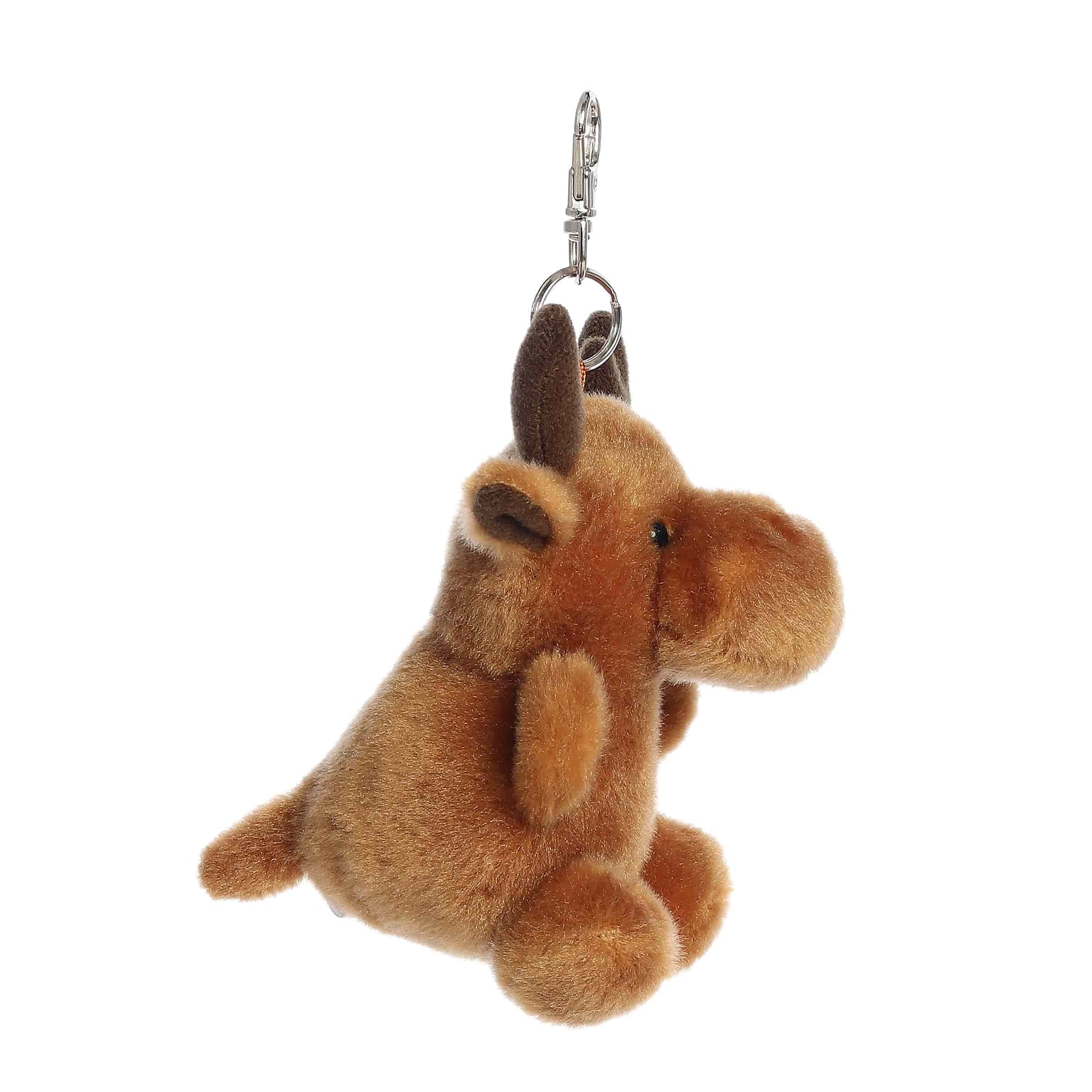Side view of Palm Pals Cinnamon Moose, a 4-inch brown plush clip.