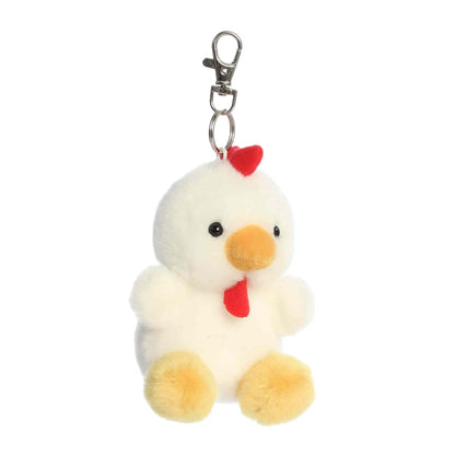 Angled view of Palm Pals Cooper Chicken, a 4-inch white plush clip.