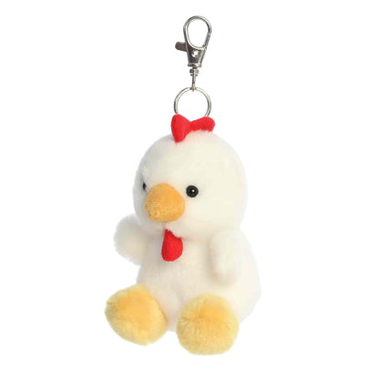 Angled view of Palm Pals Cooper Chicken, a 4-inch white plush clip.