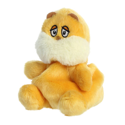 Angled view of Palm Pals Dr. Seuss The Lorax 5-inch plush soft toy