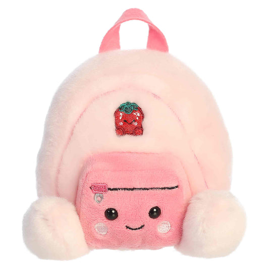Palm Pals Francisca Backpack, a small pink plush shaped like a backpack with a sweet smiling face and an embroidered strawberry patch.