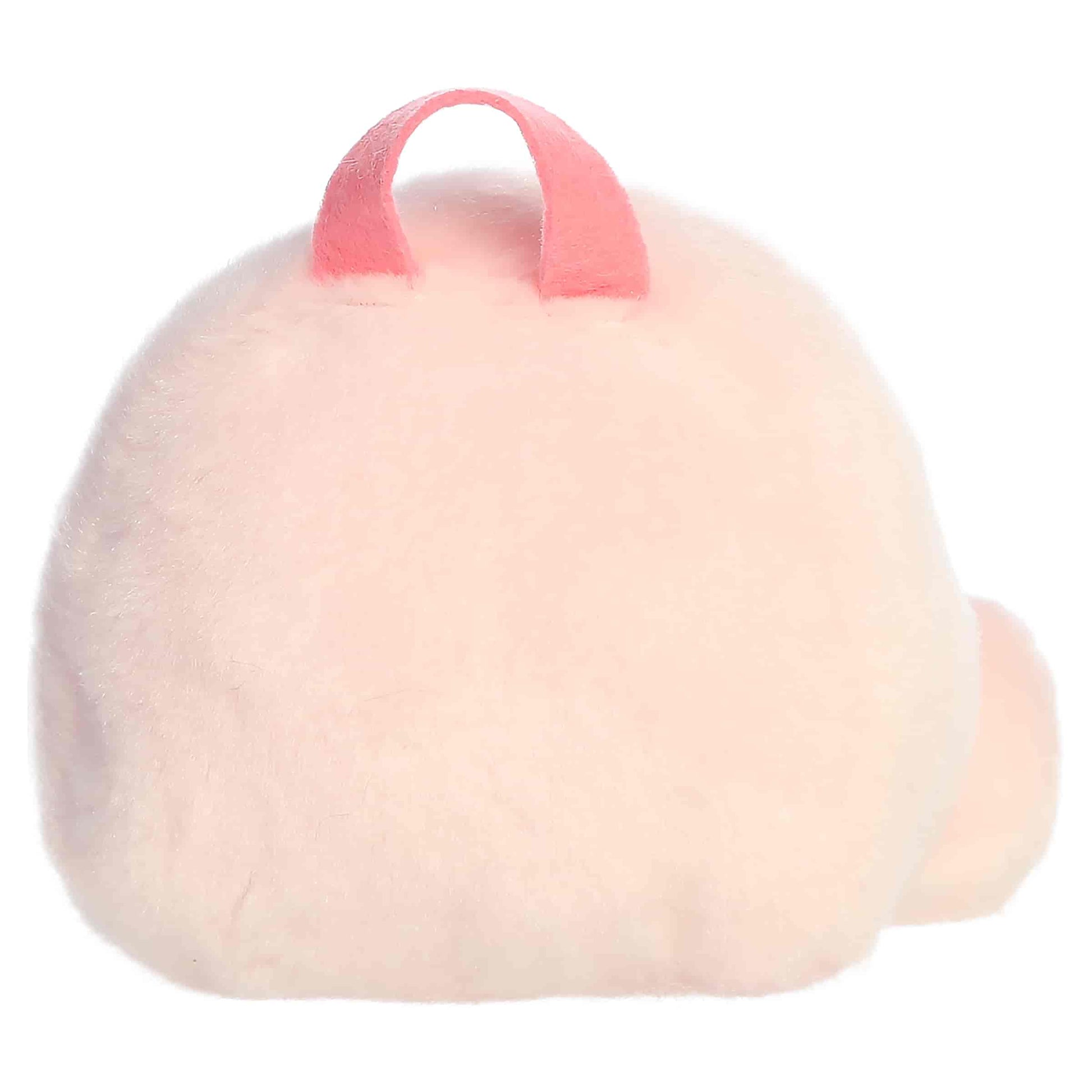 Palm Pals Francisca Backpack, a small pink plush shaped like a backpack with a sweet smiling face and an embroidered strawberry patch.