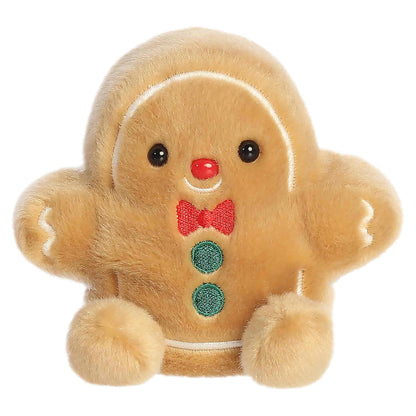 Palm Pals Gio Gingerbread Man 5-inch tan plush featuring an embroidered red bow tie, green buttons, white icing accents, and a red nose.