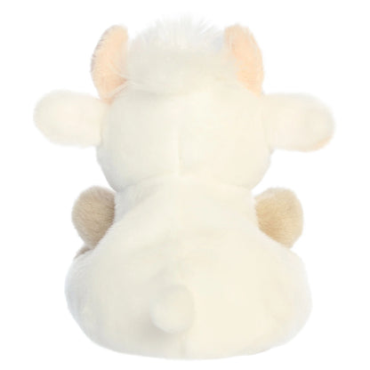 Palm Pals Halleigh Highland Cow mini plush featuring creamy white fur, a fluffy white hair tuft, tiny horns, and soft tan hooves.