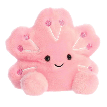 Angled view of Palm Pals Cherry Blossom Plush