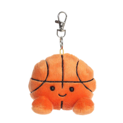 Product view of Palm Pals Hoops Basketball, a 4-inch round plush basketball with a smiling face and orange feet, featuring a plastic keychain clip.