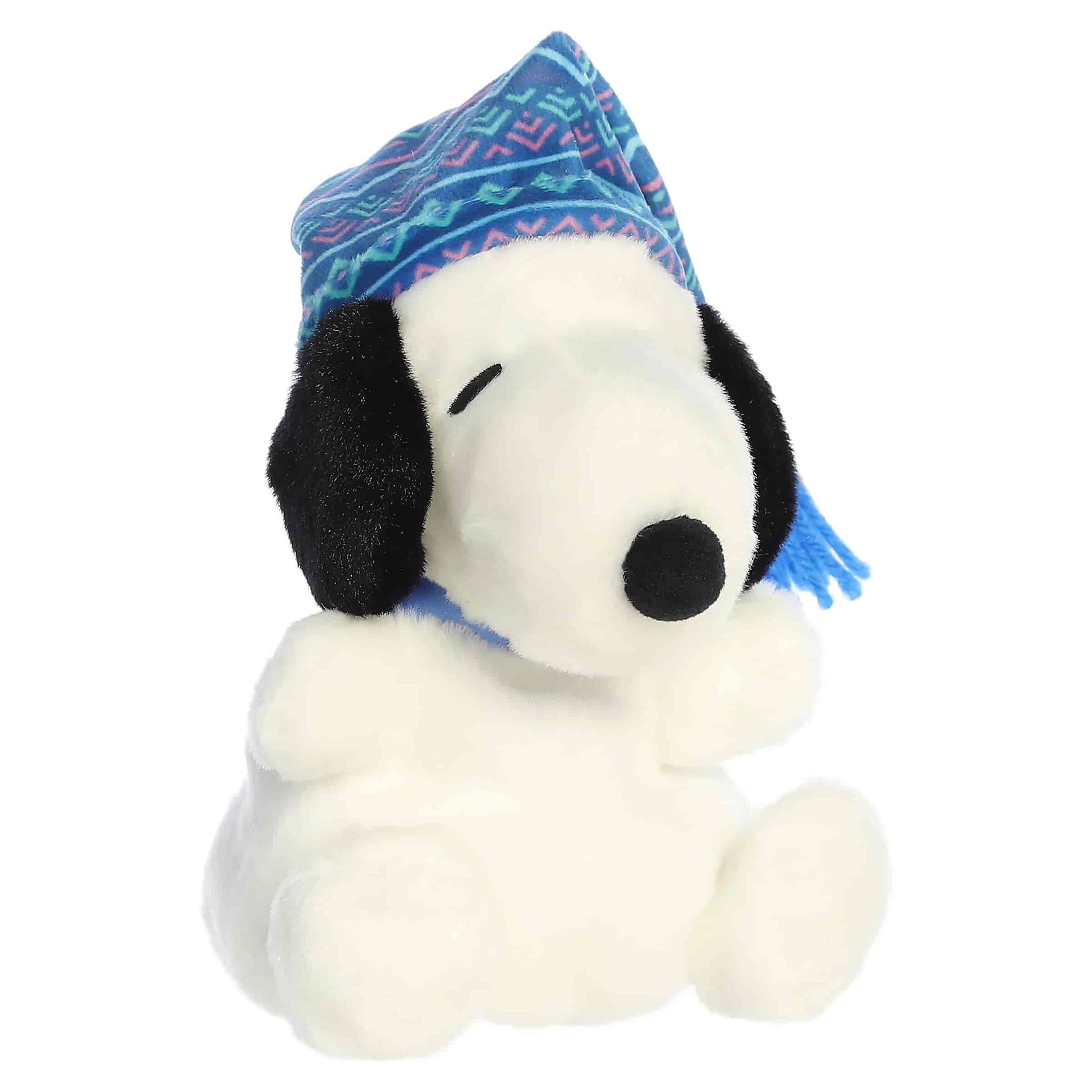 Palm Pals I Love Snow Snoopy plush wearing a blue and pink patterned winter stocking cap with a blue tassel.