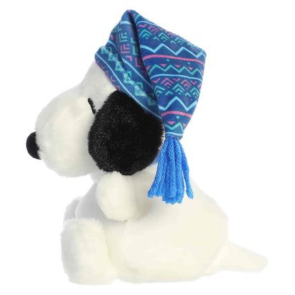 Palm Pals I Love Snow Snoopy plush wearing a blue and pink patterned winter stocking cap with a blue tassel.