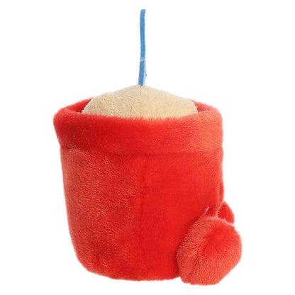 Palm Pals June Sand Bucket, a small red plush shaped like a beach bucket filled with sand and a blue shovel, featuring a sweet smiling face.