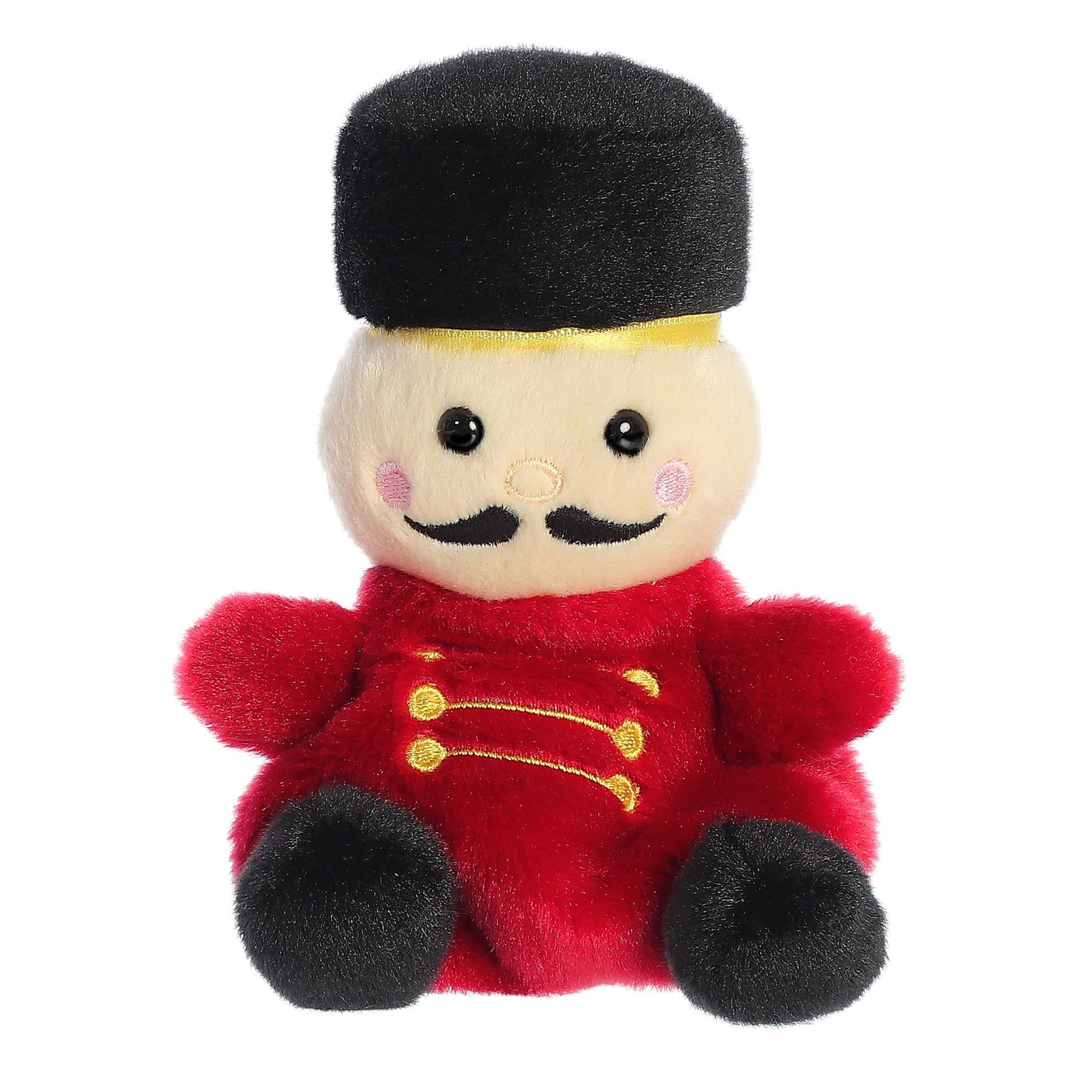 Palm Pals Marius Nutcracker plush featuring a red uniform with gold details, black boots, a black mustache, and a tall black fur hat.