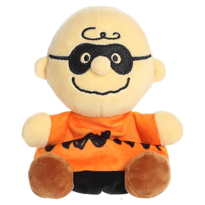 Palm Pals Masked Charlie Brown plush featuring an orange zig-zag shirt, black stitched domino eye mask, and brown shoes.