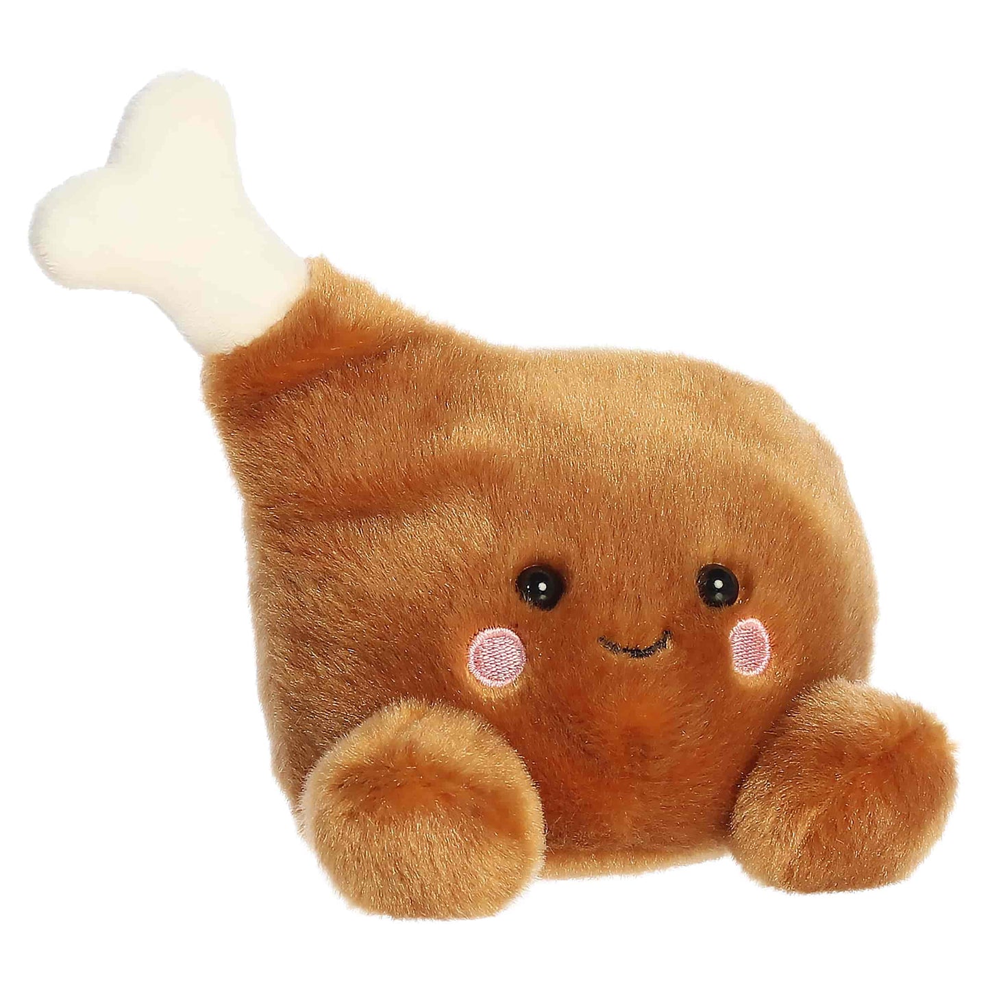 Palm Pals Mila Drumstick 6-inch golden-brown plush drumstick with a cream plush bone, embroidered smile, and rosy cheeks.