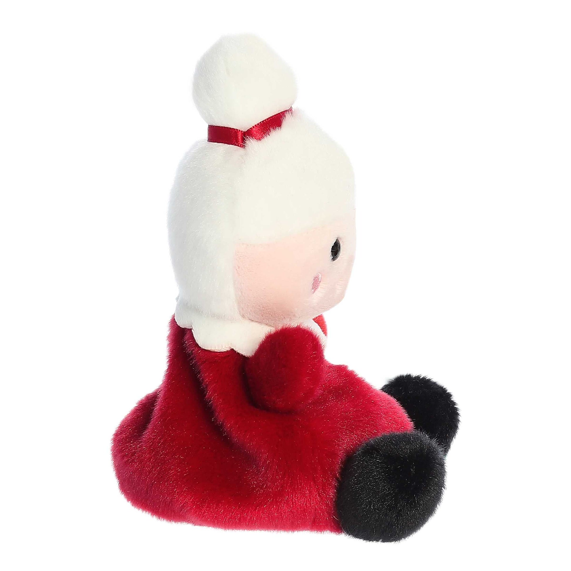Palm Pals Mrs. Claus plush wearing a red dress with a white collar, gold ribbon accent, and snowy white hair tied in a bun with a red bow.