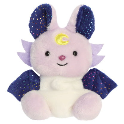 Palm Pals Nora Night Beast mythical plush toy with a dreamy lavender body, midnight-blue wings, and a yellow moon crest
