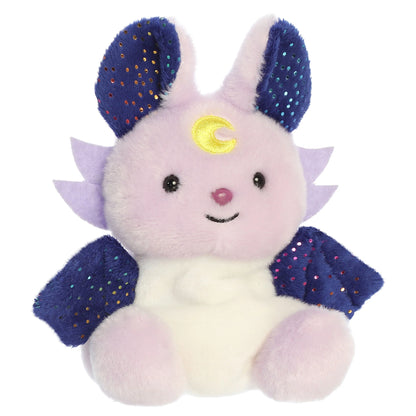 Palm Pals Nora Night Beast mythical plush toy with a dreamy lavender body, midnight-blue wings, and a yellow moon crest