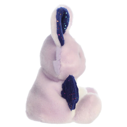 Palm Pals Nora Night Beast mythical plush toy with a dreamy lavender body, midnight-blue wings, and a yellow moon crest