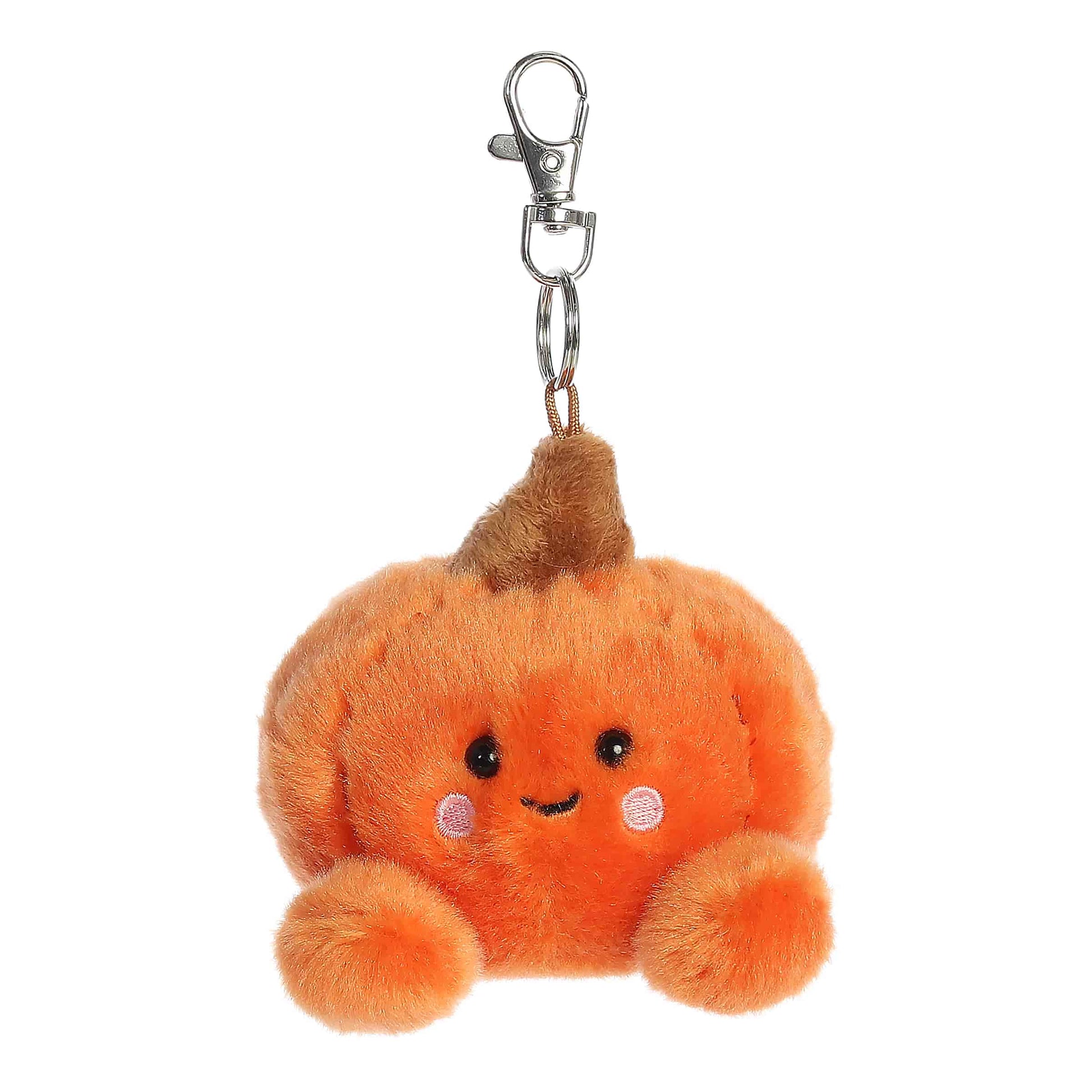 Palm Pals Paisley Pumpkin 4-inch plush clip-on featuring soft orange fur, brown plush stem, rosy cheeks, and a silver keychain clip.