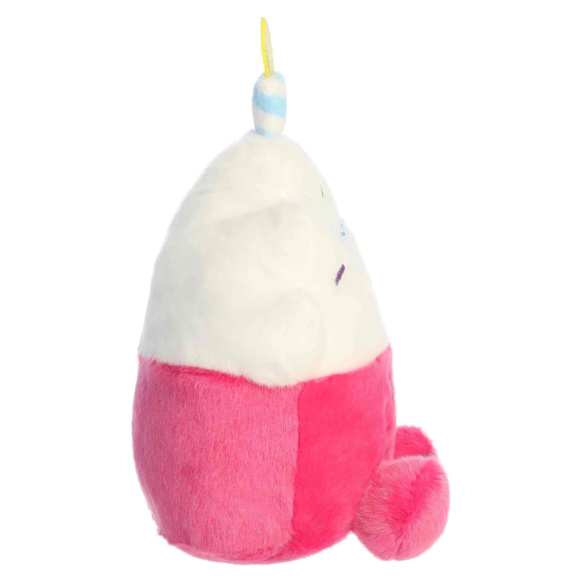 Palm Pals Party-Sized Sparkle Birthday Cupcake plush featuring a bright pink base, white frosting, embroidered sprinkles, and a birthday candle.