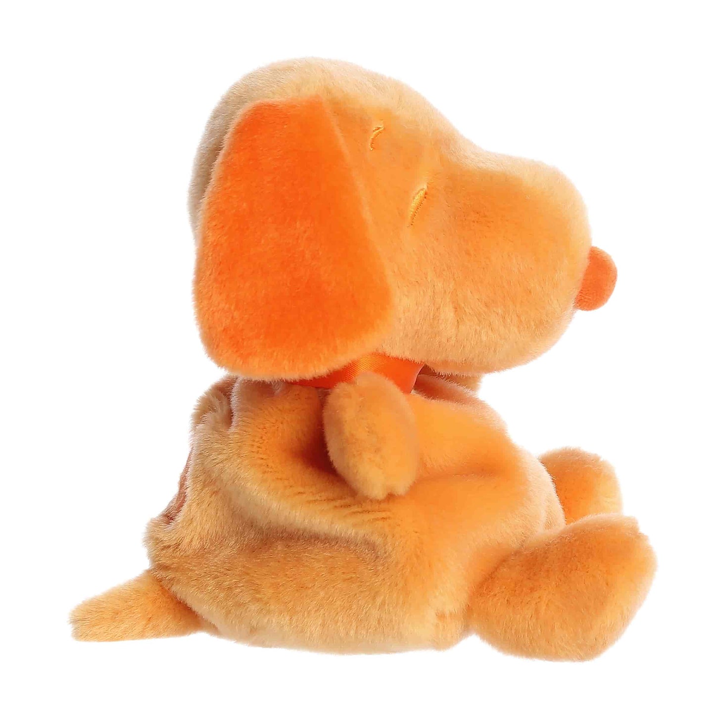 Side view of Palm Pals Peanuts Snoopy Color Collection Orange 5-inch plush soft toy