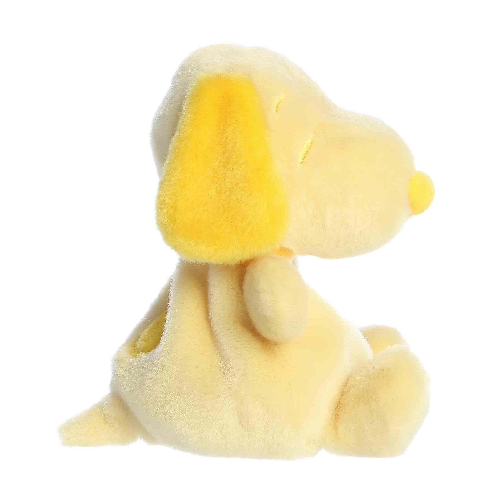 Side view of Palm Pals Peanuts Snoopy Color Collection Yellow 5-inch plush soft toy