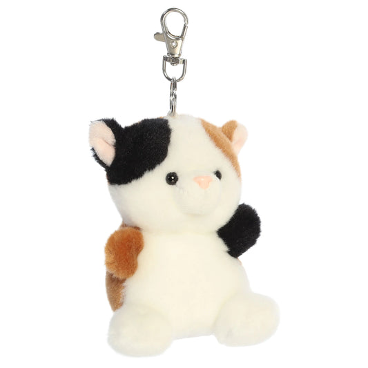 Palm Pals Peebs Calico Cat Clip-On plush toy featuring black, white, and brown spots, a mellow expression, and a metal keychain clip.