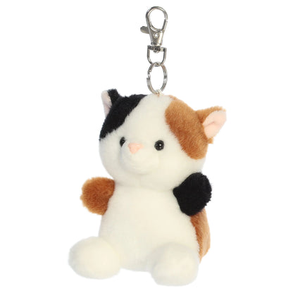 Palm Pals Peebs Calico Cat Clip-On plush toy featuring black, white, and brown spots, a mellow expression, and a metal keychain clip.