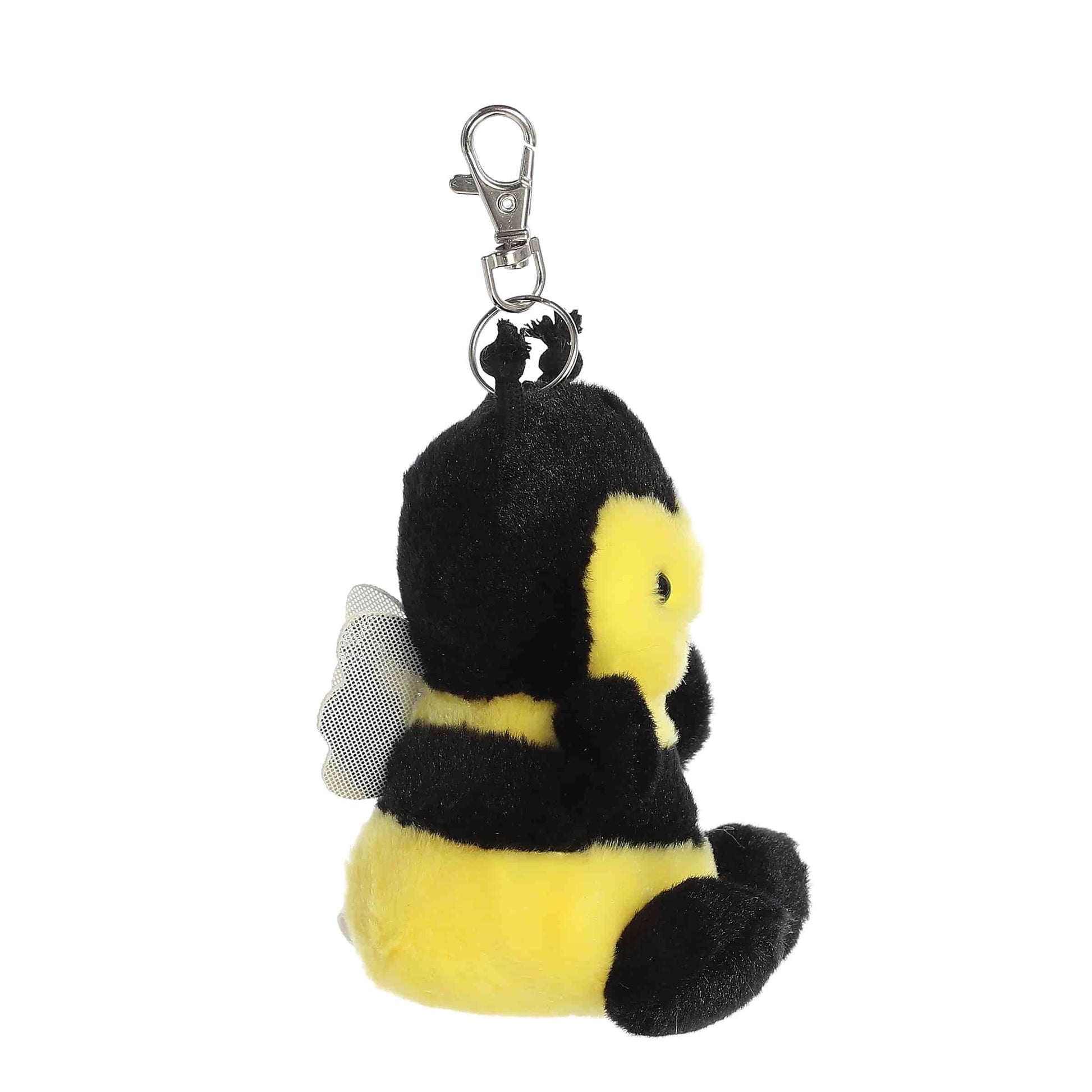 Side view of Palm Pals Queeny Bee, a 4-inch black and yellow plush clip.